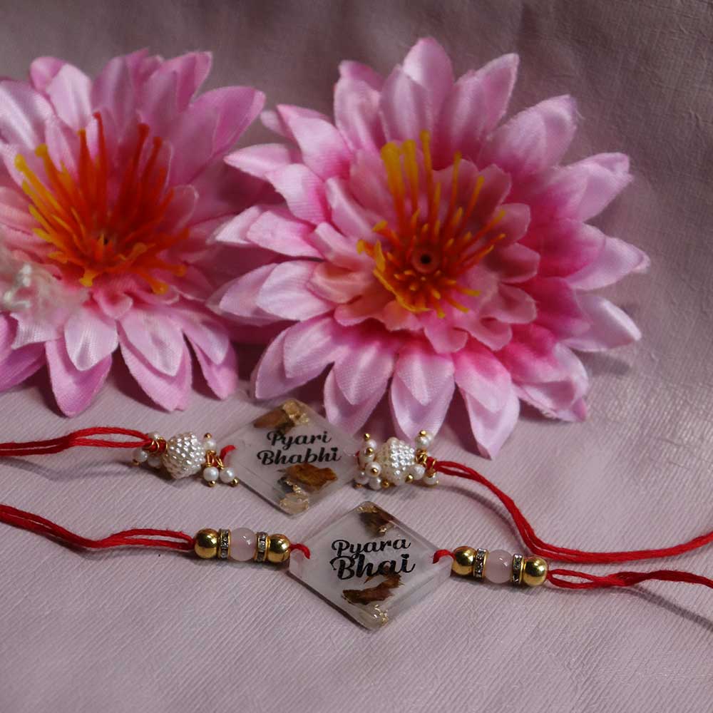 Transparent Resin Couple Rakhi - Image 3