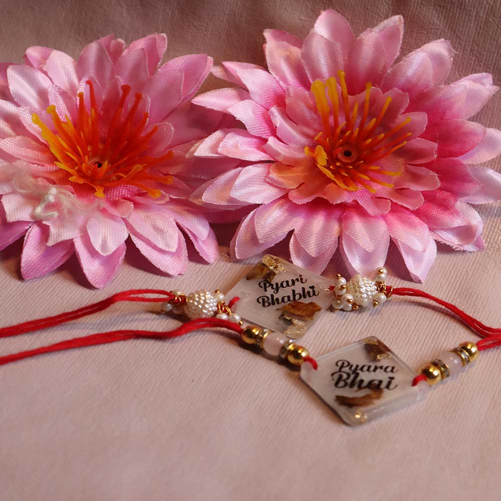 Transparent Resin Couple Rakhi - Image 4